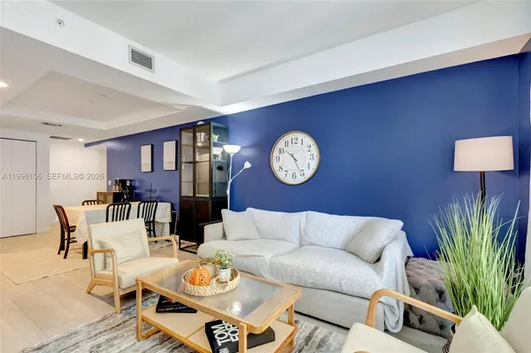 a bedroom with a bed and chair