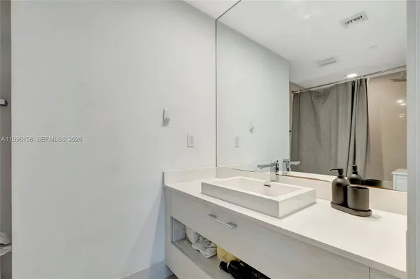 a bathroom with a toilet and shower