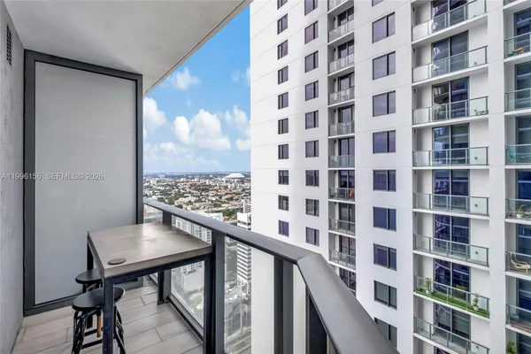 a bathroom with a sink and a shower curtain