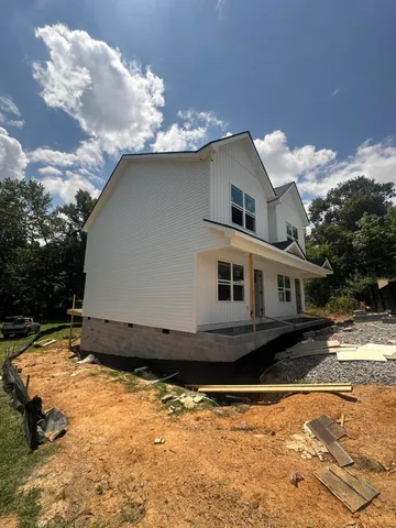 a house with trees in the background