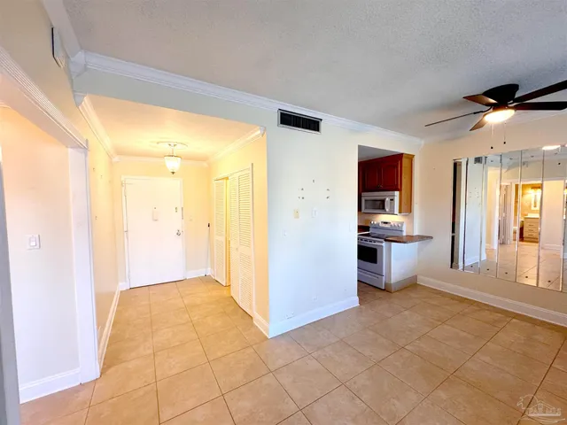 a kitchen with a sink a refrigerator and a stove