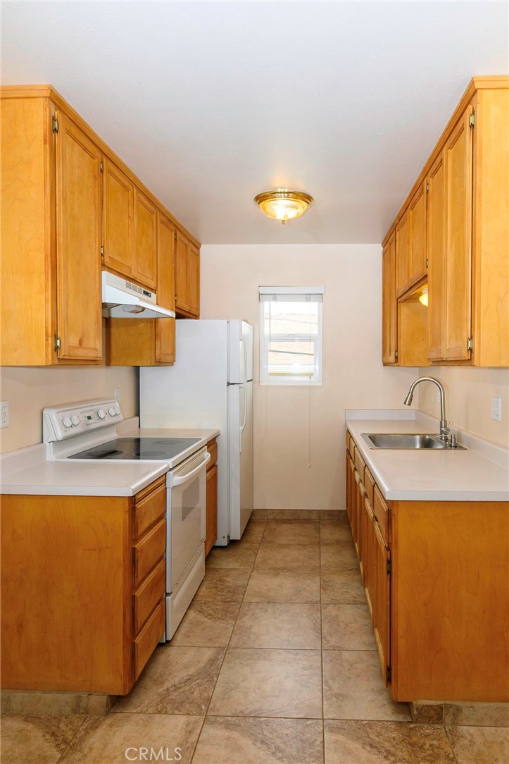 171 Brisco Road, Unit 8 Arroyo Grande, CA 93420 - Photo 2 of 23 a kitchen with a sink stove and cabinets