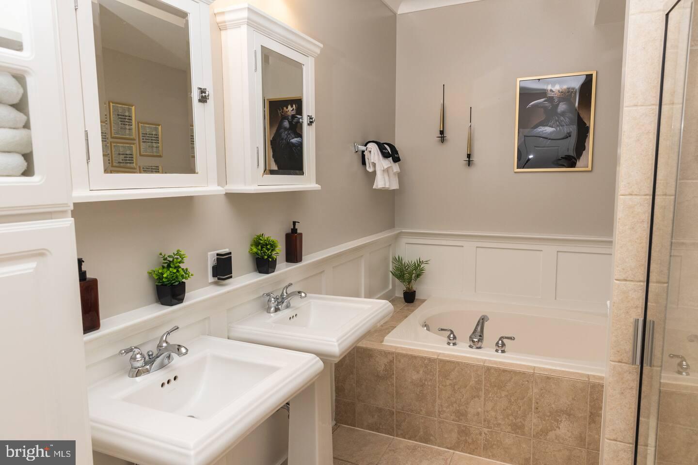 24 South Regester Street Baltimore, MD 21231 - Photo 16 of 32 Elegant dual-sink bathroom retreat.