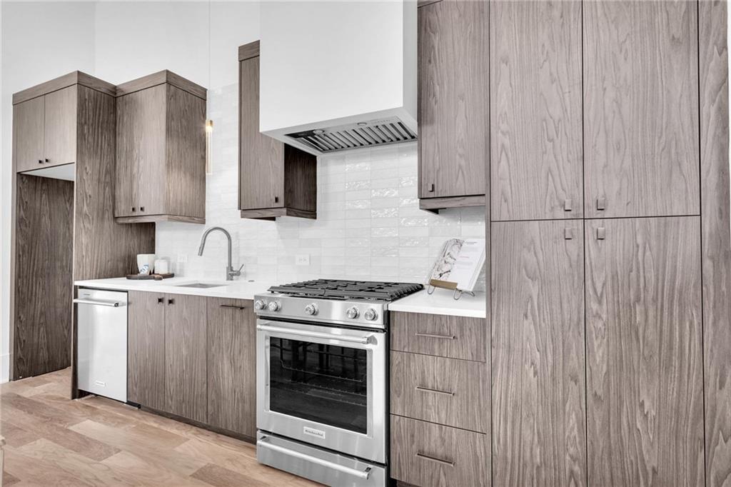 1250 Lupo Loop Chattahoochee Hills, GA 30268 - Photo 15 of 49 a kitchen with a stove and a sink
