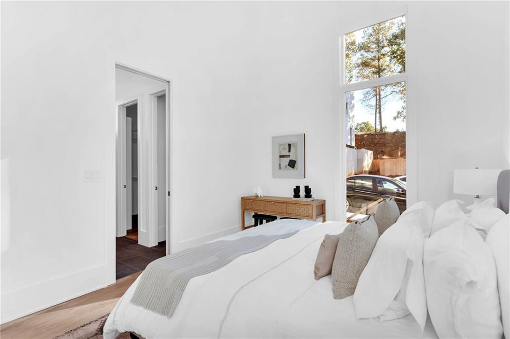 1250 Lupo Loop Chattahoochee Hills, GA 30268 - Photo 20 of 49 a bedroom with a bed and a window