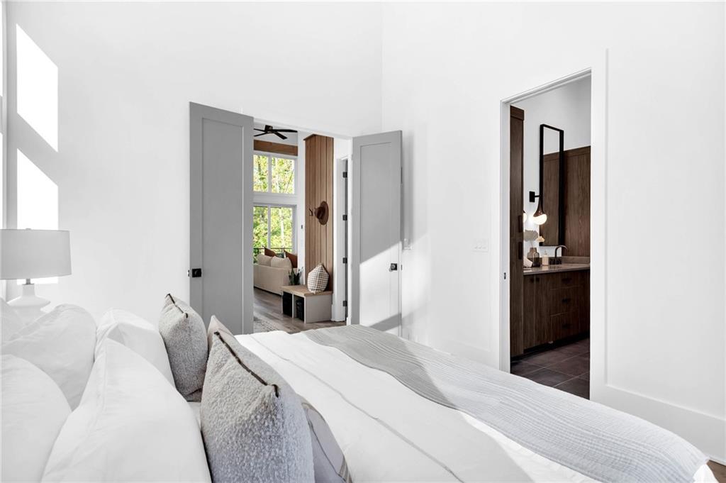 1250 Lupo Loop Chattahoochee Hills, GA 30268 - Photo 22 of 49 a bedroom with a bed and a window