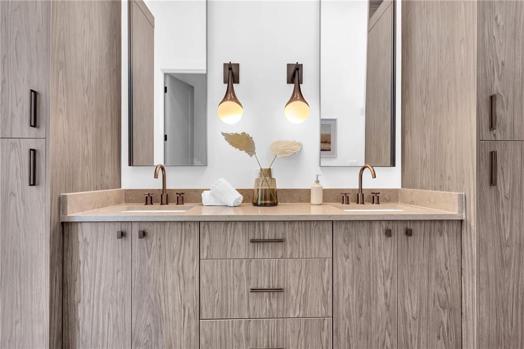 1250 Lupo Loop Chattahoochee Hills, GA 30268 - Photo 26 of 49 a bathroom with a double vanity sink and a mirror