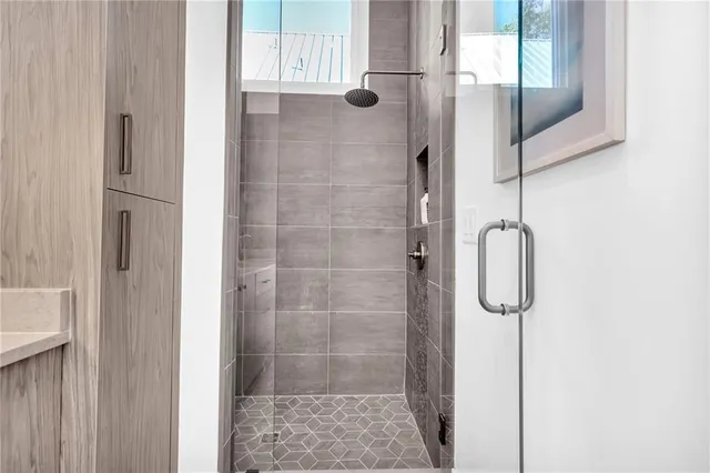 a bathroom with a double vanity sink and a mirror