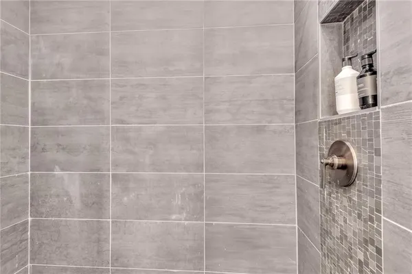 a spacious bedroom with a large bed and a window