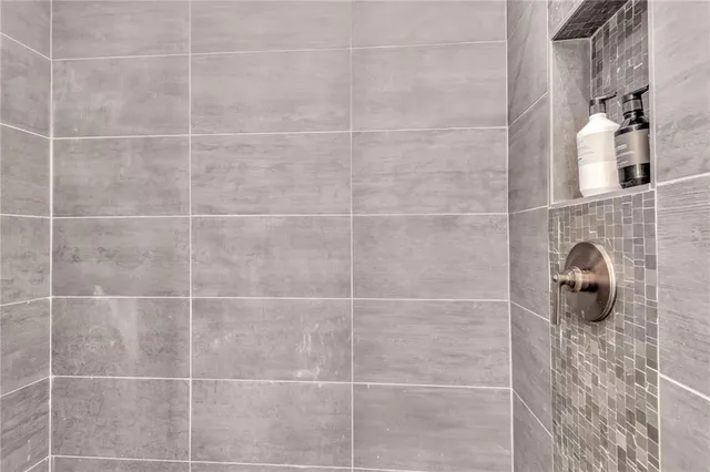 a spacious bedroom with a large bed and a window