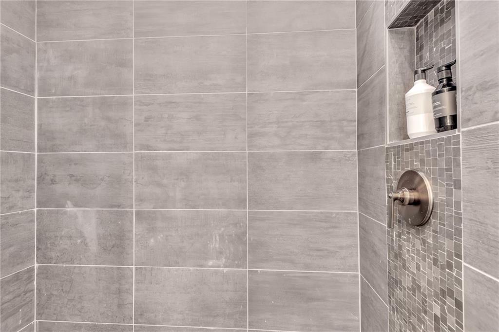 1250 Lupo Loop Chattahoochee Hills, GA 30268 - Photo 28 of 49 a bathroom with a shower