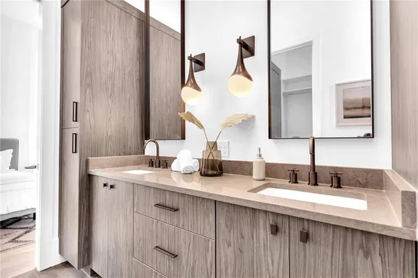 a bedroom with a bed and a night stand