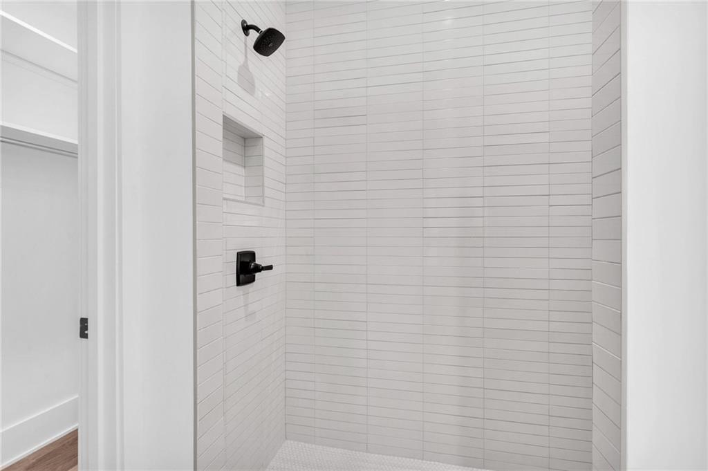 1250 Lupo Loop Chattahoochee Hills, GA 30268 - Photo 36 of 49 a bathroom with a shower