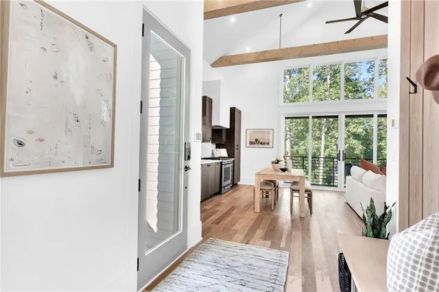 a living room with furniture and a large window