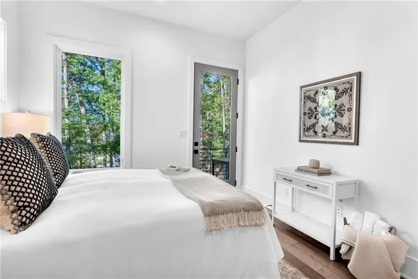 a view of a room with wooden floor and outdoor view