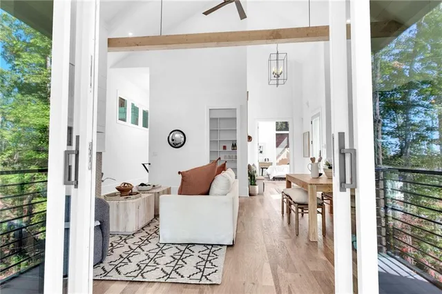 a balcony with furniture and a potted plant