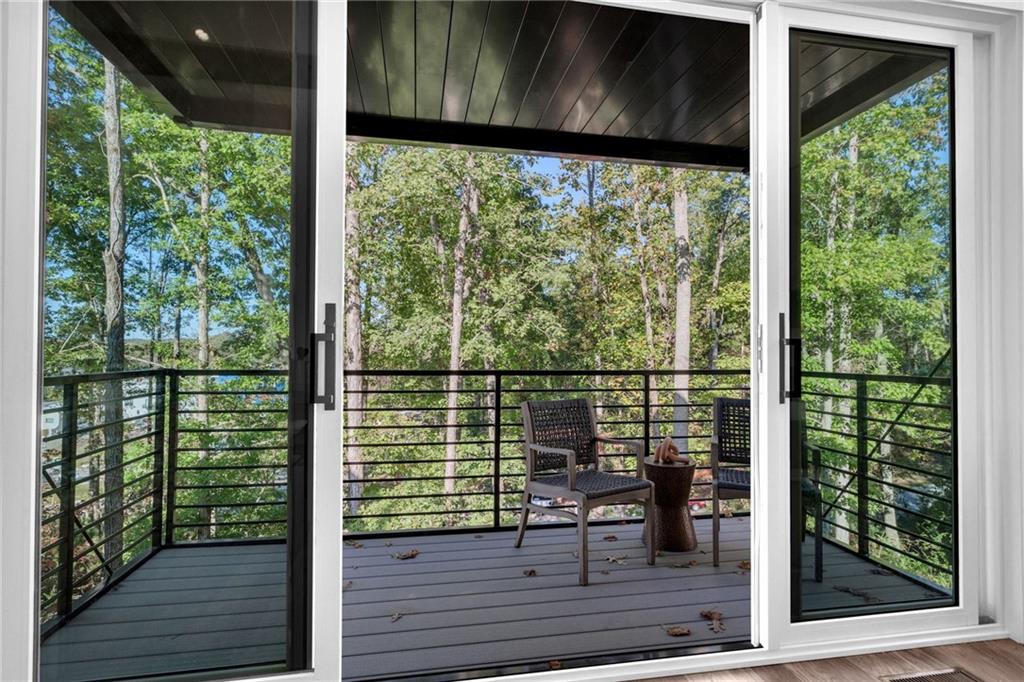 1250 Lupo Loop Chattahoochee Hills, GA 30268 - Photo 44 of 49 a view of a room with wooden floor and outdoor view