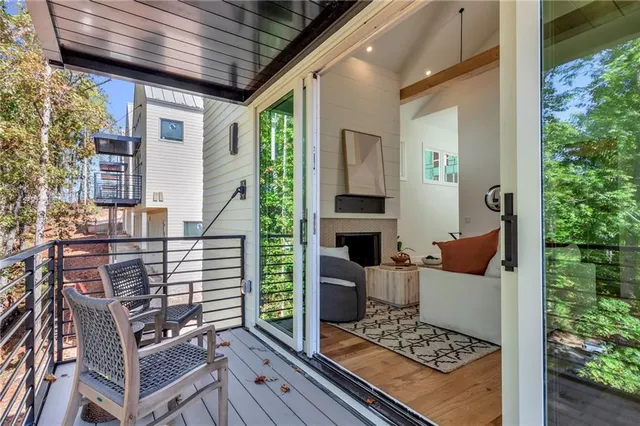 a backyard of a house with barbeque oven table and chairs