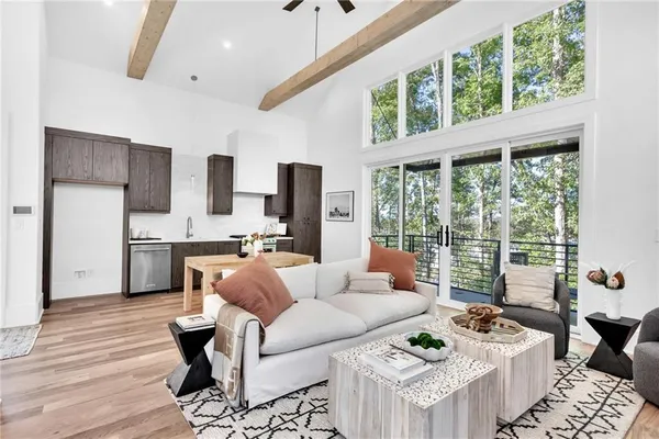 a living room with furniture and a rug