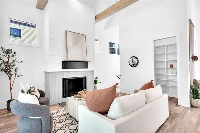 a living room with furniture and a fireplace