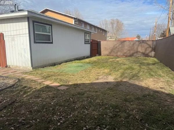 a view of small yard with an outdoor space
