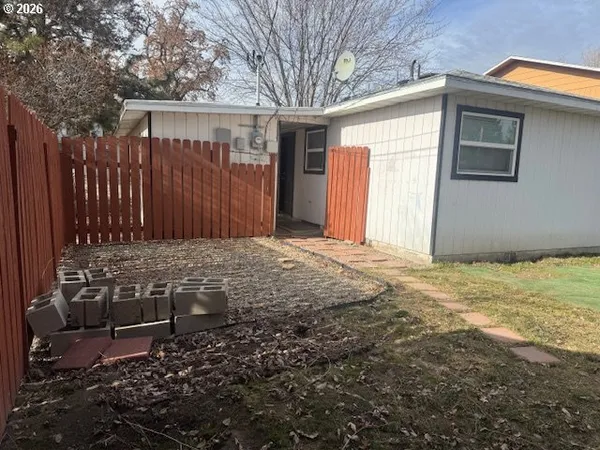 a view of a backyard of the house