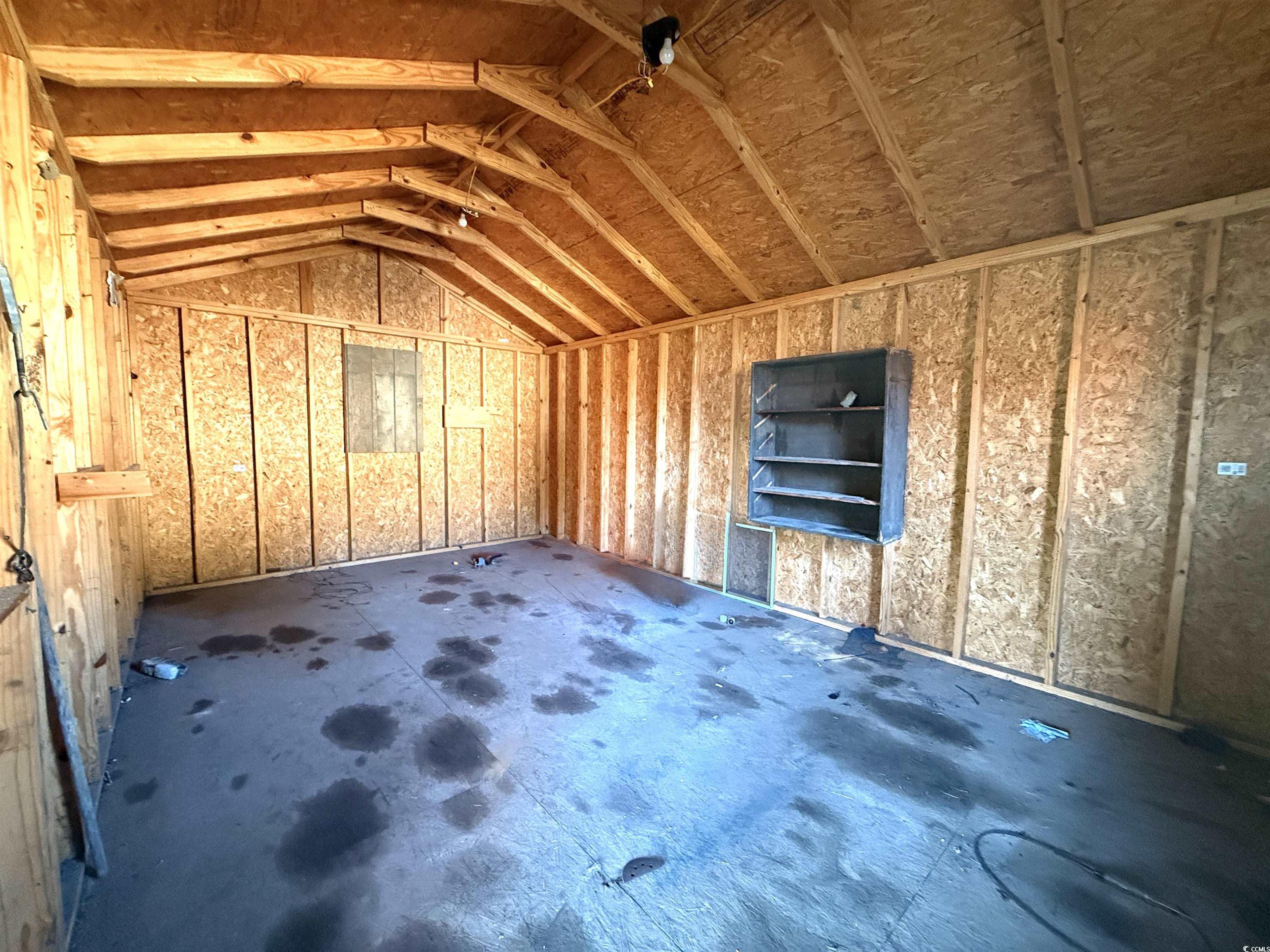 2765 County Line Road Andrews, SC 29510 - Photo 14 of 22 Larger Storage Building with attached covered shed