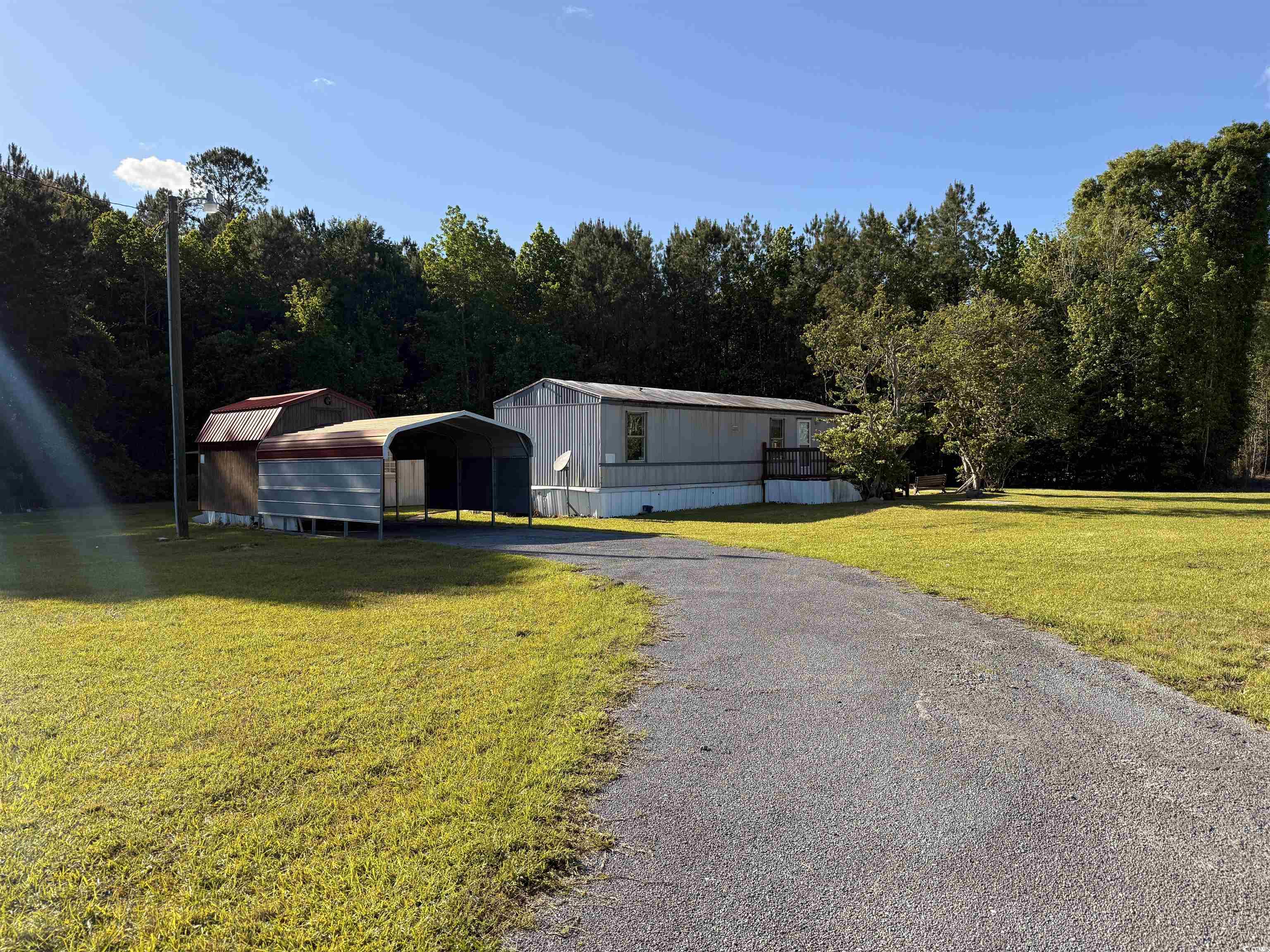 2765 County Line Road Andrews, SC 29510 - Photo 20 of 22 Manufactured / mobile home with a detached carport
