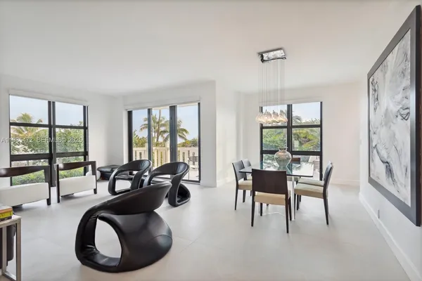 a dining room with furniture and windows