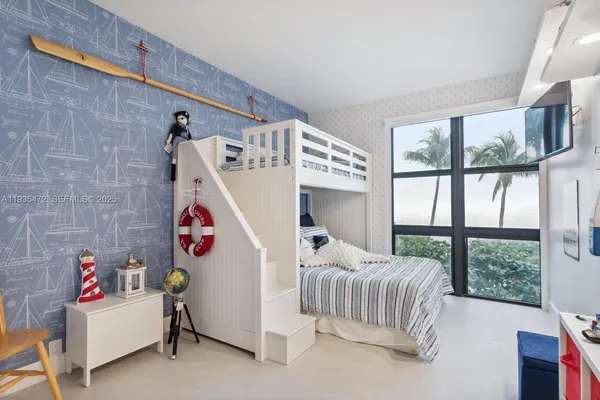 a bedroom with furniture and a bed