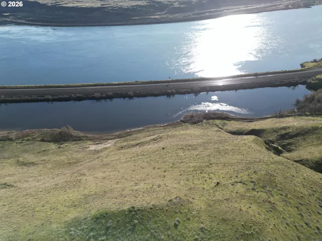 a view of swimming pool with a yard in back