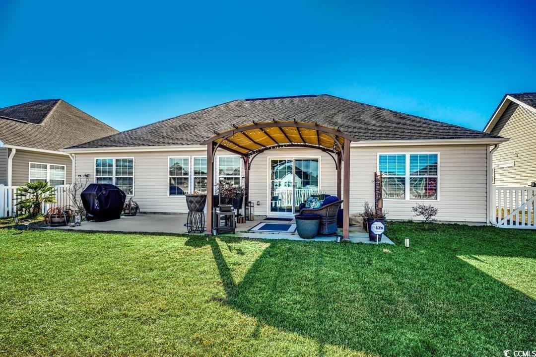 257 Leste Road Myrtle Beach, SC 29588 - Photo 29 of 35 Back of house featuring a pergola, a patio area, a