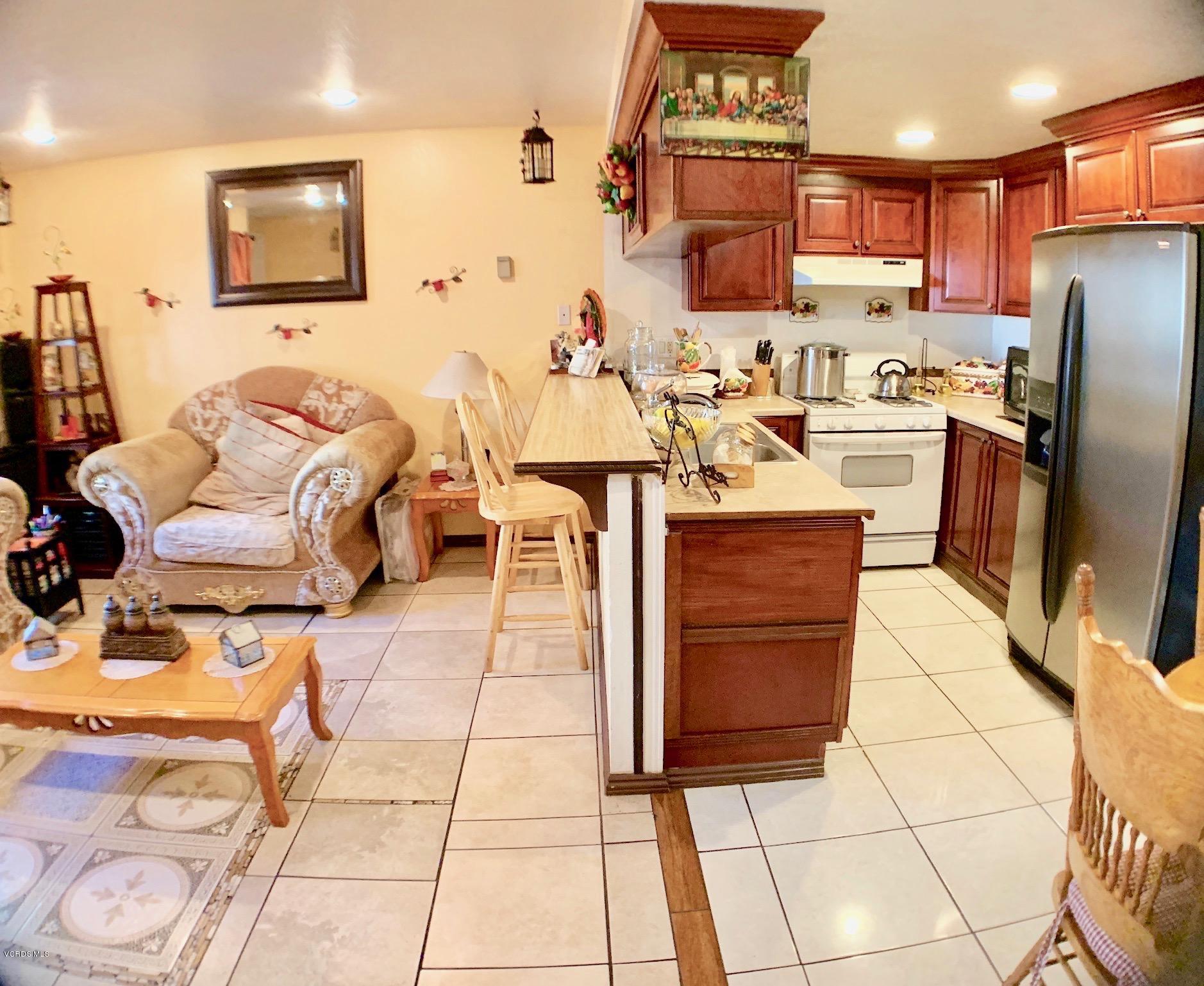 4562 Saviers Road Oxnard, CA 93033 - Photo 11 of 29 a kitchen with a sink and cabinets