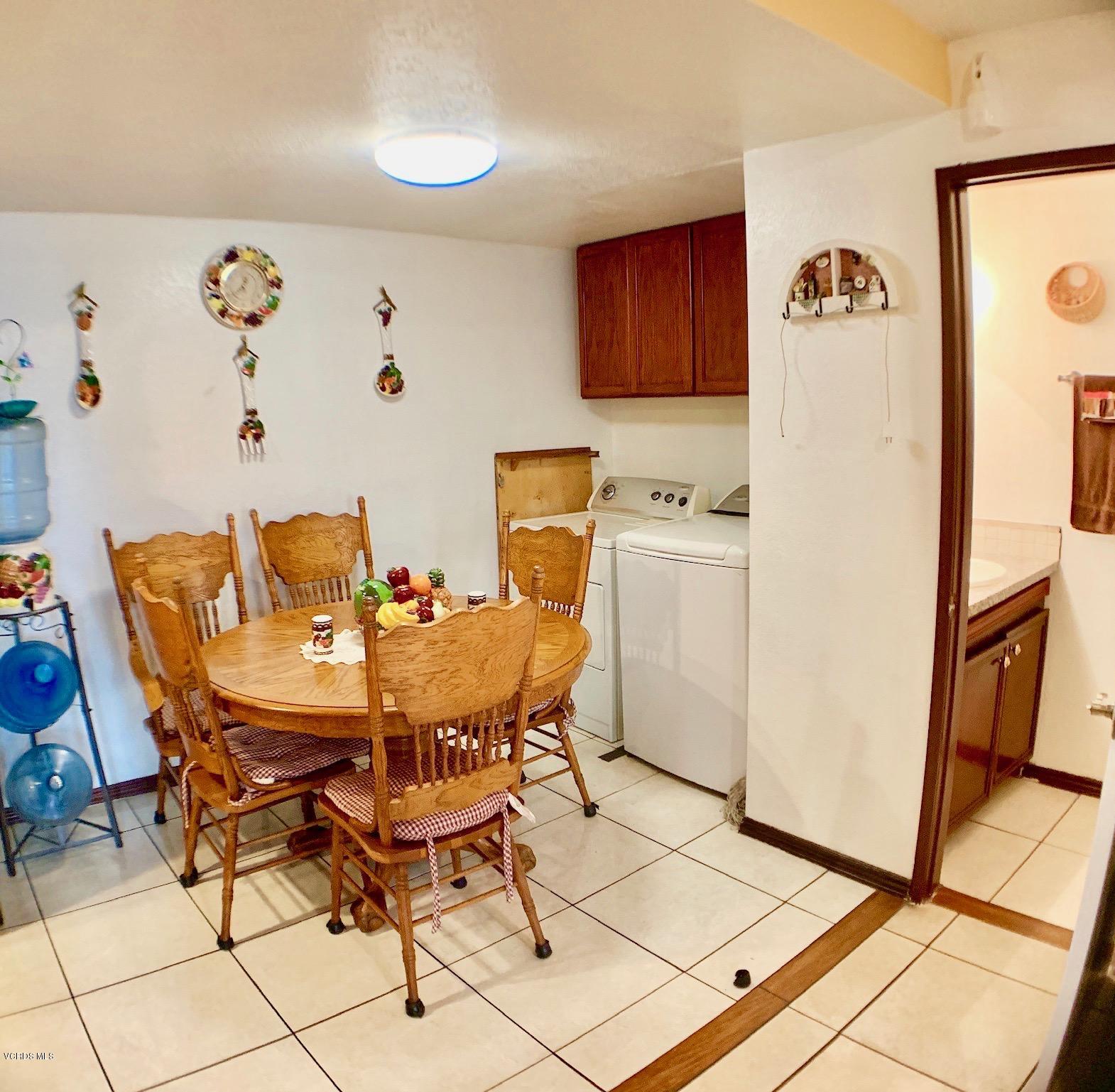 4562 Saviers Road Oxnard, CA 93033 - Photo 12 of 29 a view of a dining room with furniture and a refrigerator