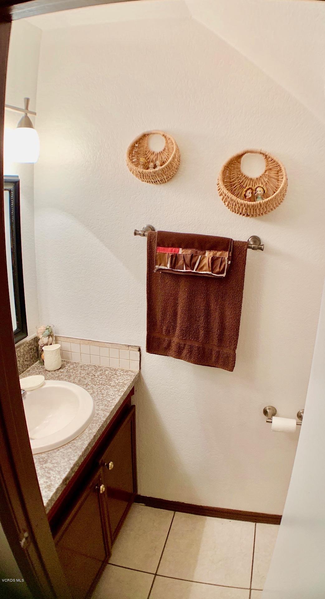 4562 Saviers Road Oxnard, CA 93033 - Photo 13 of 29 a bathroom with a sink and a mirror