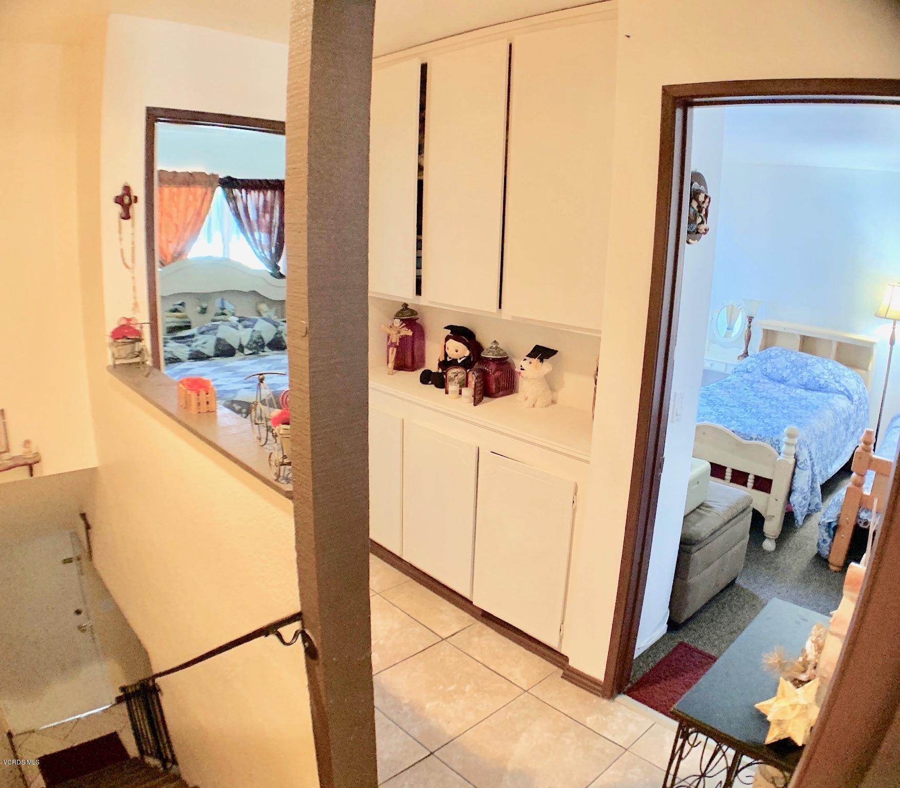 4562 Saviers Road Oxnard, CA 93033 - Photo 14 of 29 a view of a hallway with washer and dryer