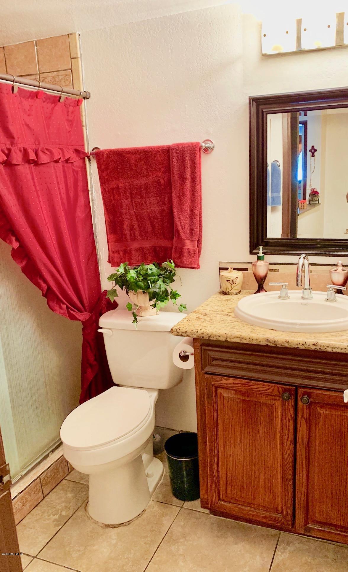 4562 Saviers Road Oxnard, CA 93033 - Photo 15 of 29 a bathroom with a sink toilet and mirror