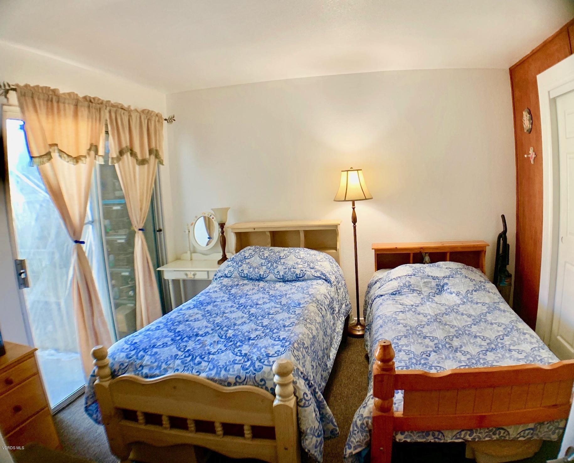4562 Saviers Road Oxnard, CA 93033 - Photo 18 of 29 a bedroom with two beds and a walk in closet