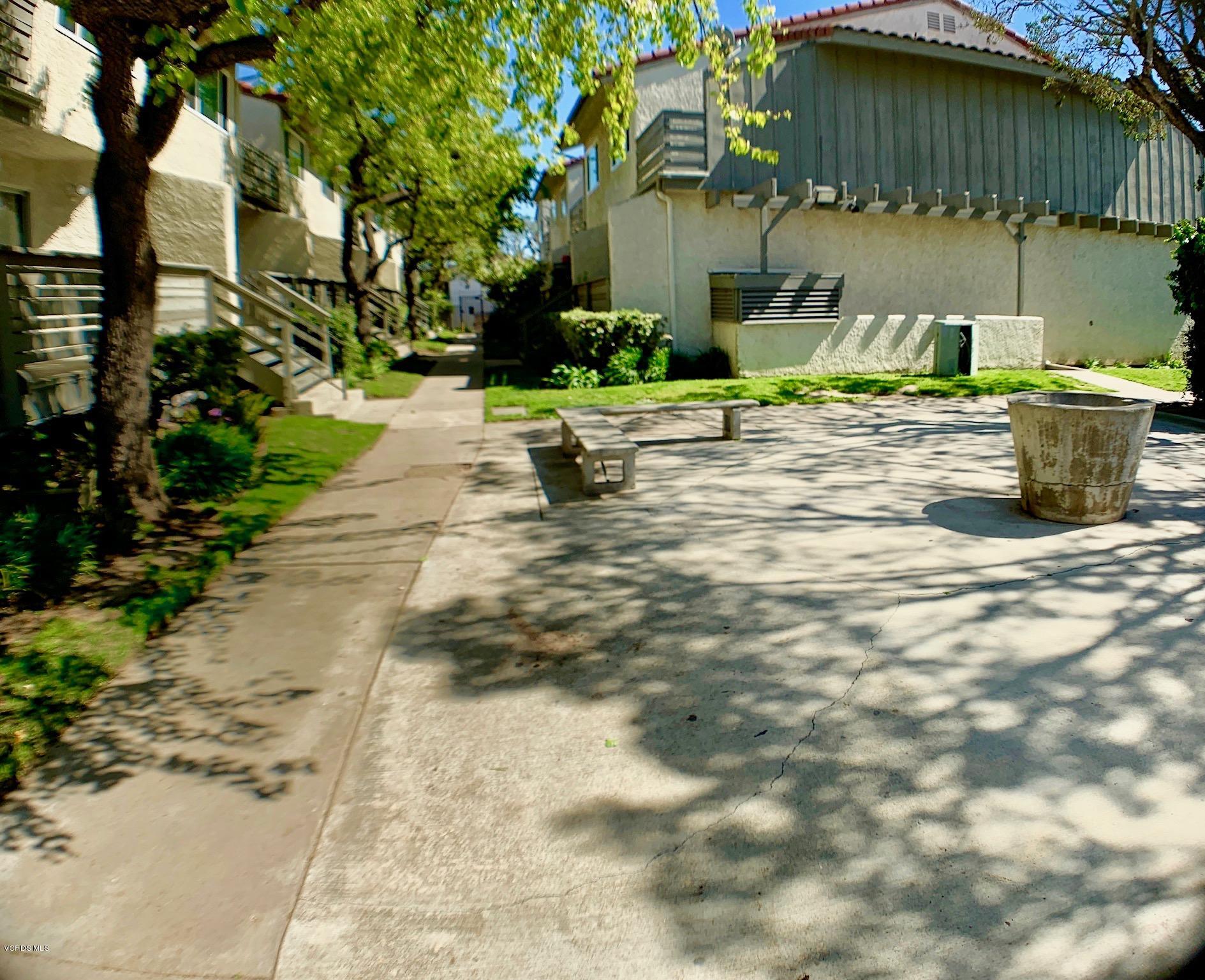 4562 Saviers Road Oxnard, CA 93033 - Photo 24 of 29 a backyard of a house with lots of green space and fountain