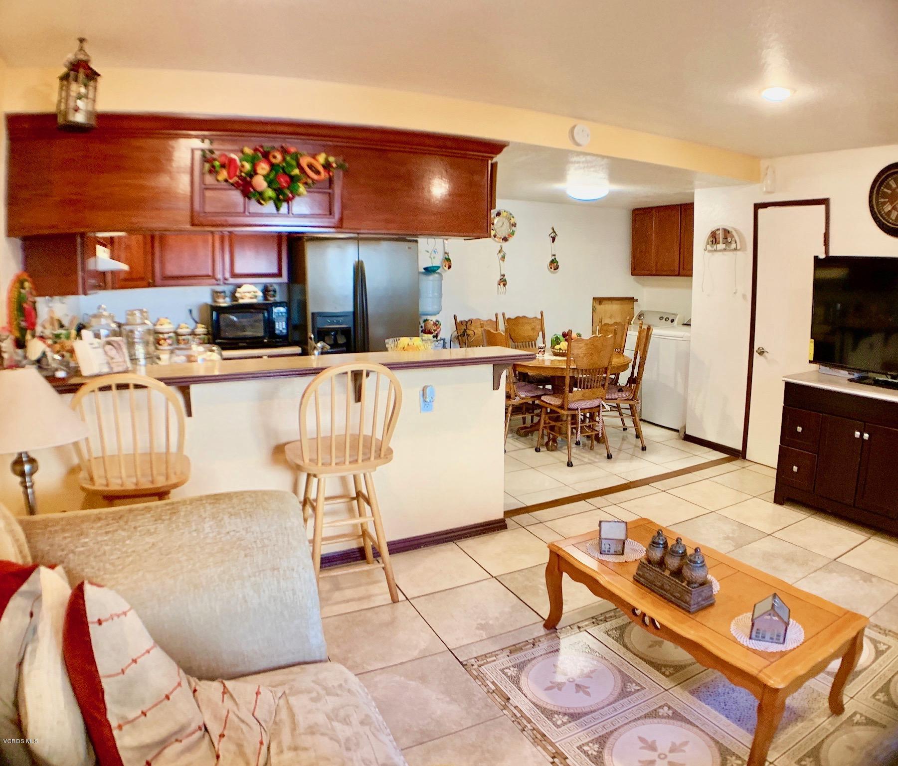 4562 Saviers Road Oxnard, CA 93033 - Photo 6 of 29 a living room with furniture and a flat screen tv