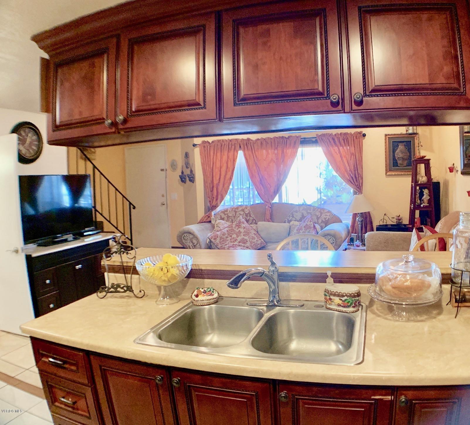 4562 Saviers Road Oxnard, CA 93033 - Photo 8 of 29 a kitchen with a sink cabinets and appliances