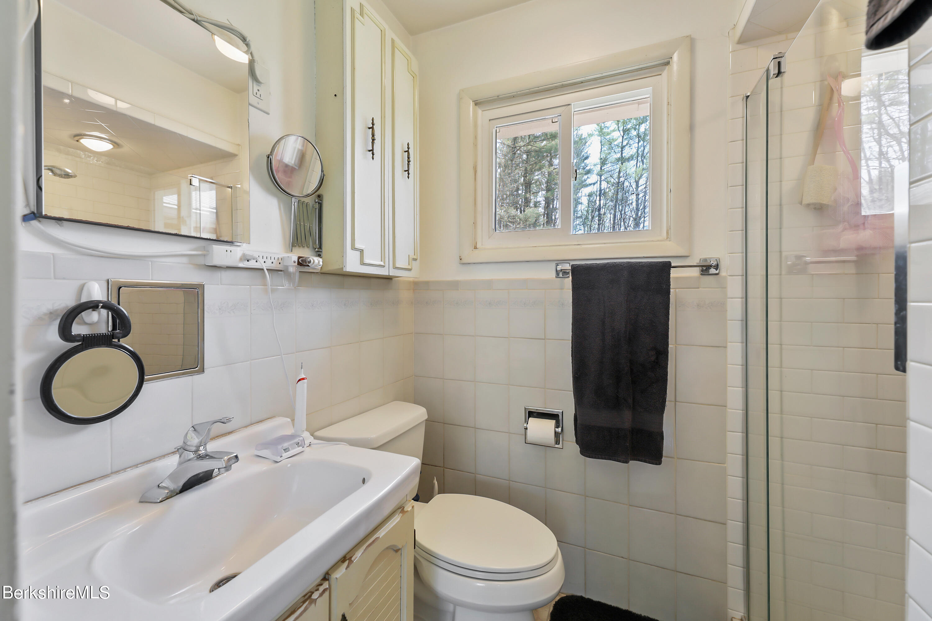36 Lenox Road West Stockbridge, MA 01266 - Photo 18 of 30 a bathroom with a toilet a sink a mirror and a window