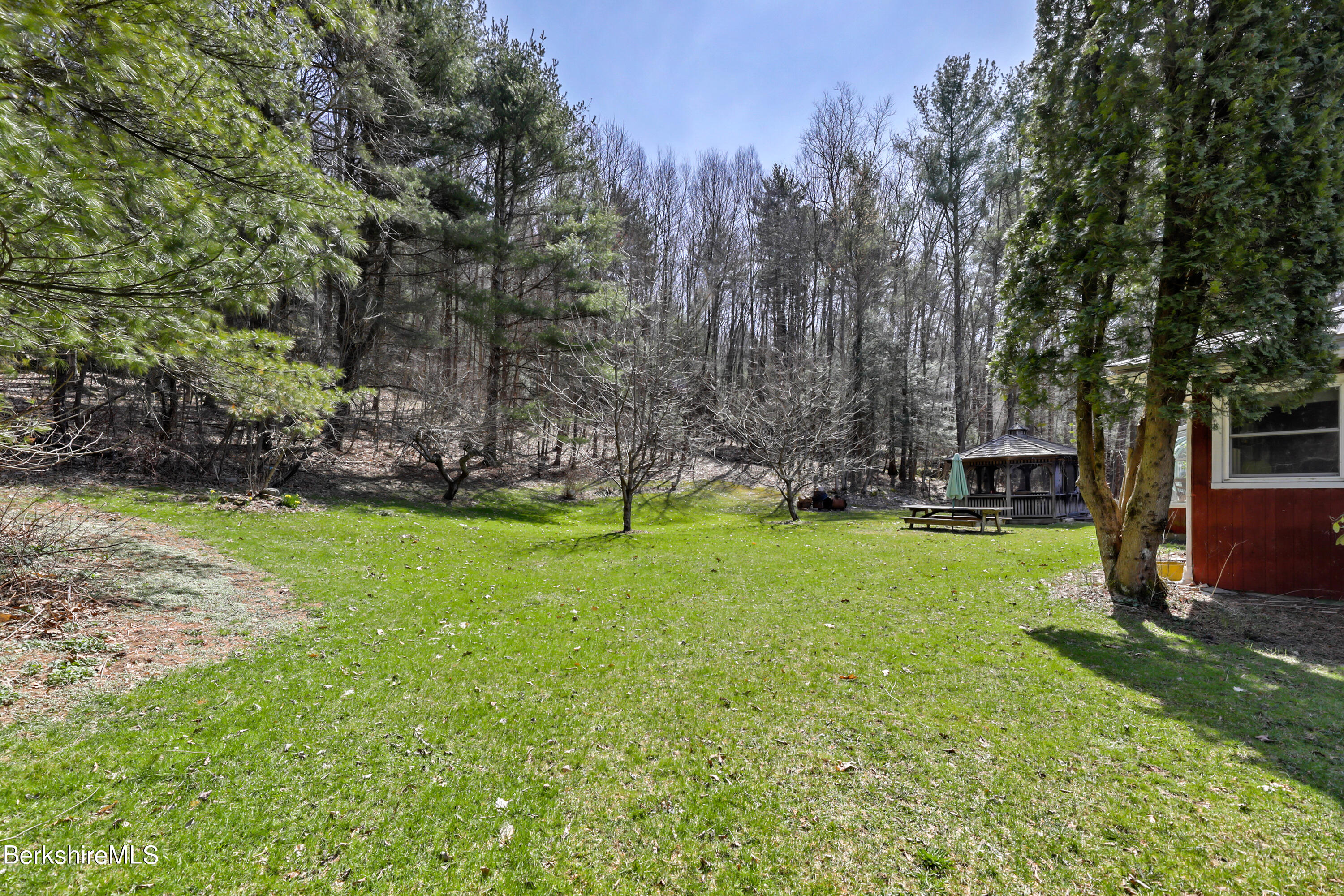 36 Lenox Road West Stockbridge, MA 01266 - Photo 25 of 30 a view of a backyard with large trees