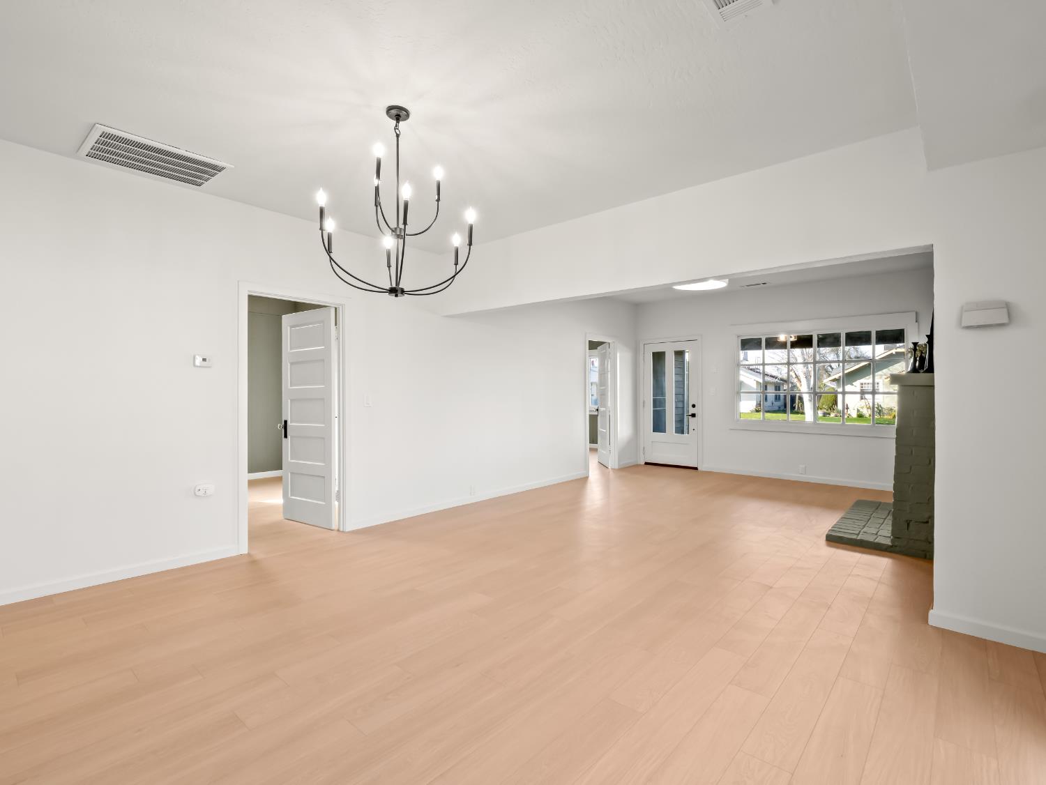 425 West Elm Street Hanford, CA 93230 - Photo 5 of 18 a view of an empty room with a window