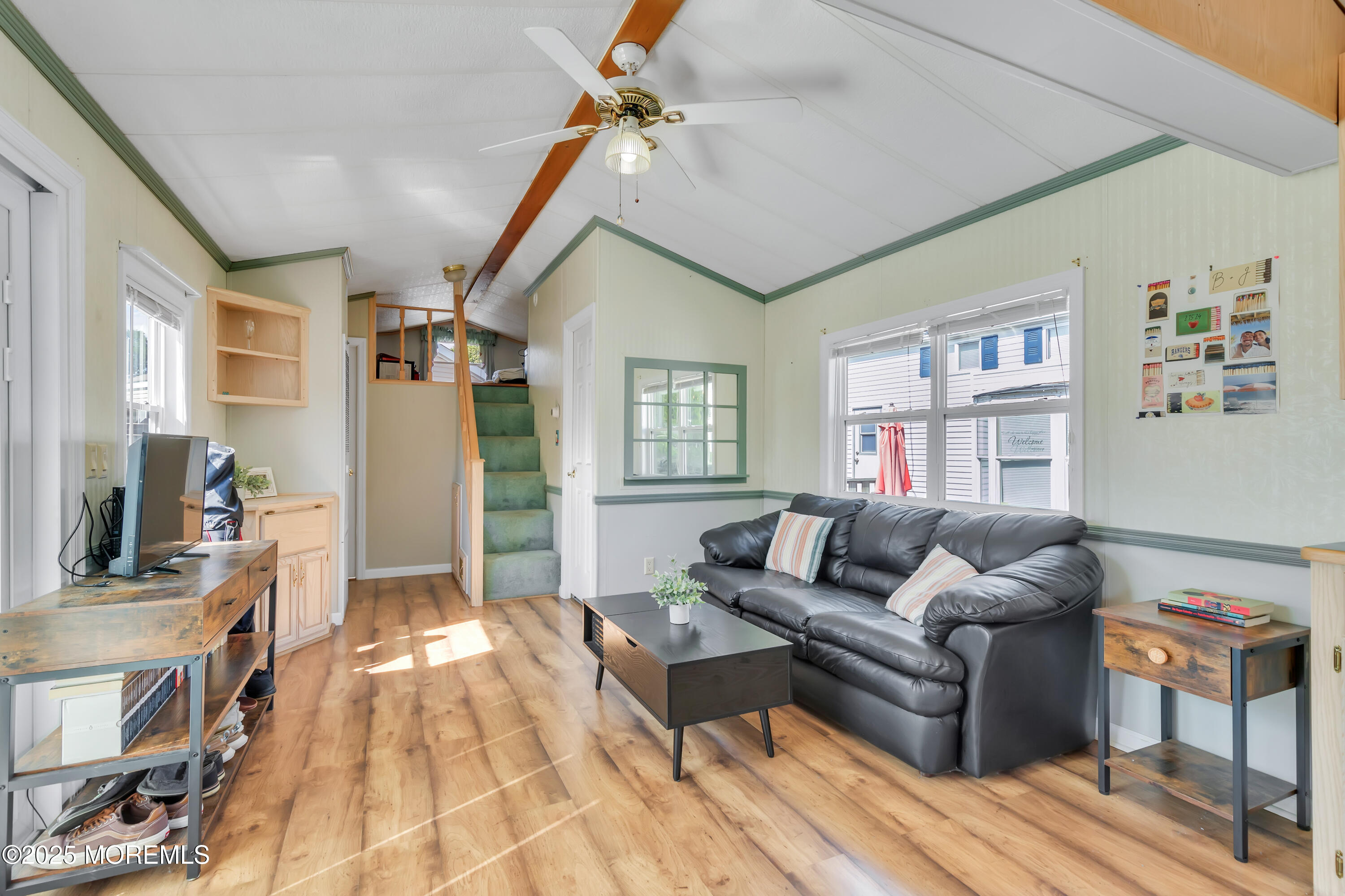 709 Union Avenue, Unit 3 Brielle, NJ 08730 - Photo 12 of 17 a living room with furniture and a flat screen tv