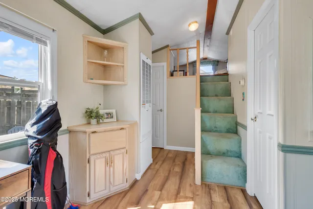 a view of a hallway with workspace and entryway