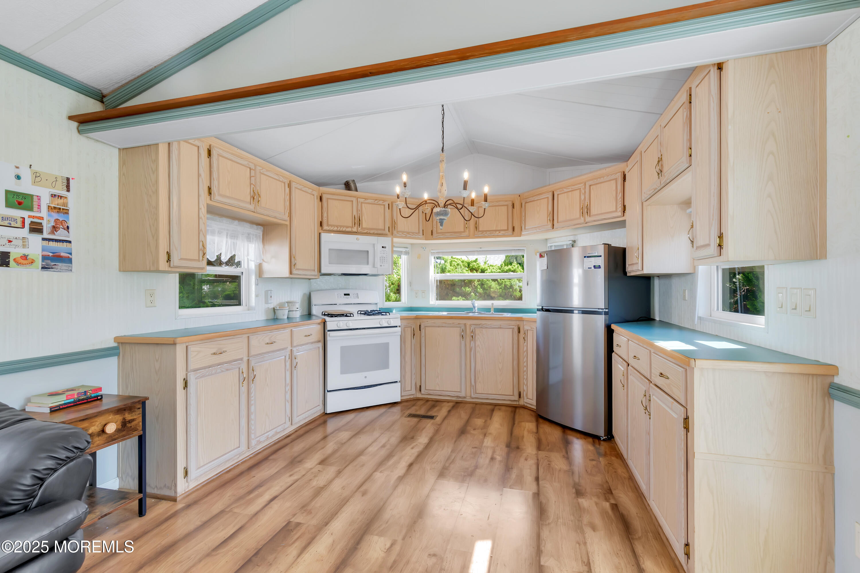 709 Union Avenue, Unit 3 Brielle, NJ 08730 - Photo 9 of 17 a kitchen with a white wooden cabinets and white appliances