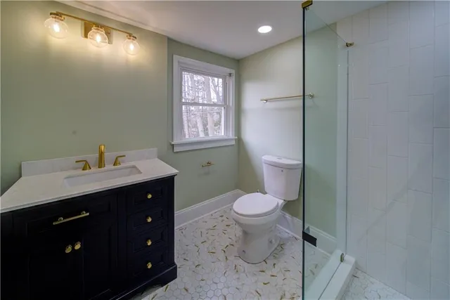 a bathroom with a sink toilet and a tub