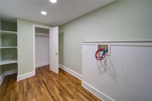 a view of hallway with wooden floor