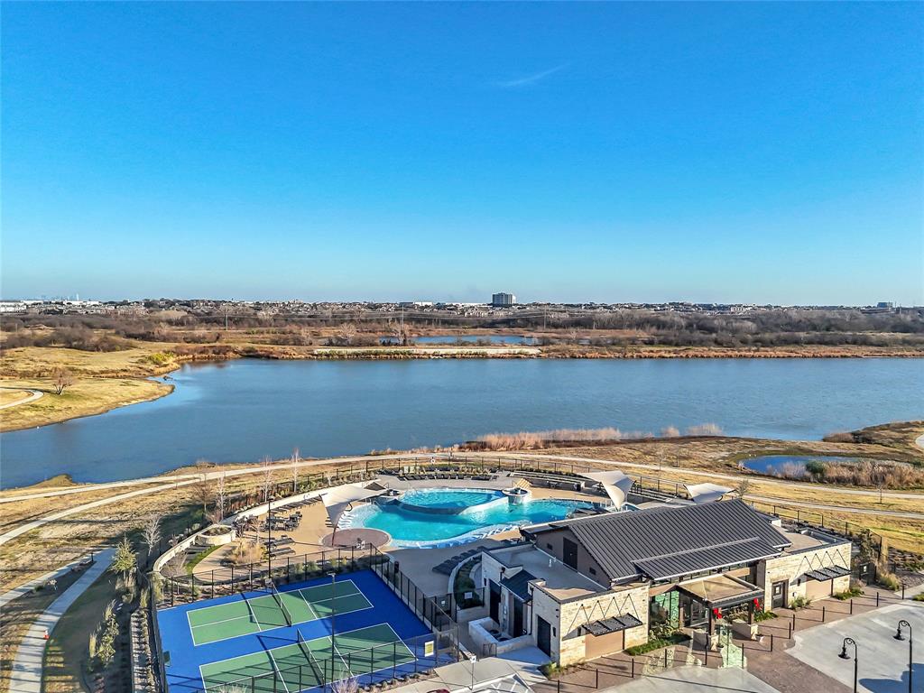 1011 Prairie Ridge Lane Arlington, TX 76005 - Photo 3 of 32 Community amenities featuring a modern clubhouse, resort-style pool, and tennis courts